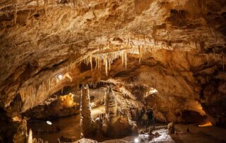 Tall cave chamber with stalactites and stalagmites in Lipa Cave, Cetinje Montenegro