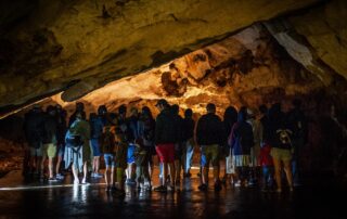 Large group of visitors on a guided tour inside Lipa Cave, Montenegro